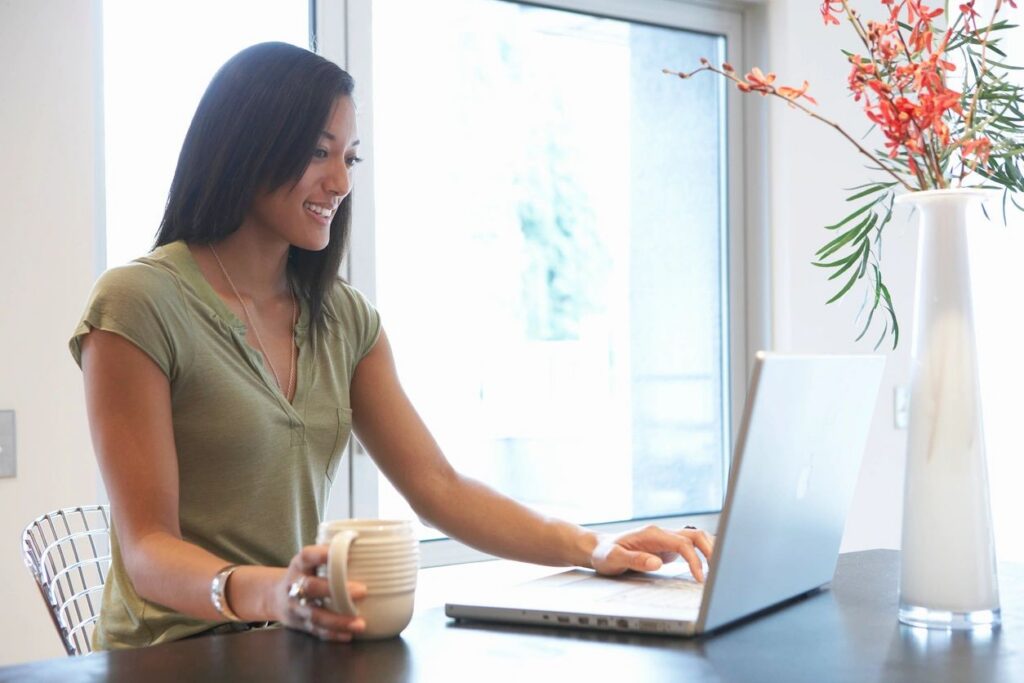 Picture of a woman at a computer conduction a virtual organizing session.