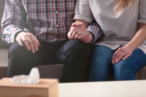 Picture of a couple holding hands.